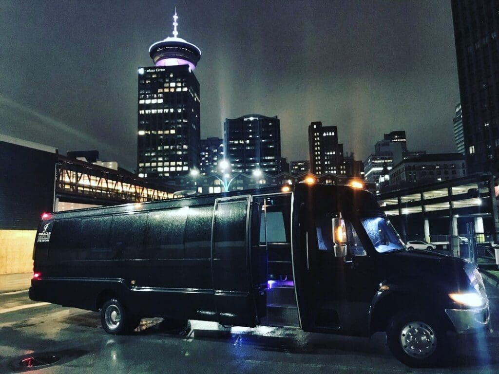 Party Bus parked in Parking in front of a bright city skyline of Grafton, Massachusetts