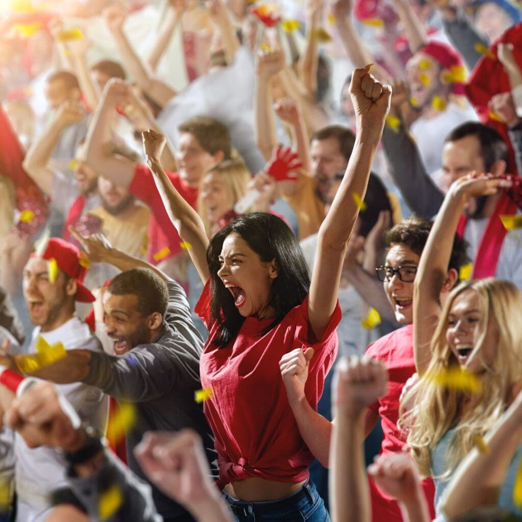 Energetic crowd cheering at a sporting event in Worcester Ma