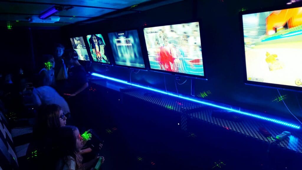 kids playing games in a gaming party bus